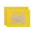 A yellow card featuring the silhouette of a crab in solid gold leaf.