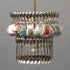 An unconventional Double Teacup chandelier made from suspended silverware and vintage teacups by Hester & Cook.