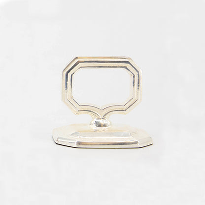 A vintage Hester &amp; Cook napkin ring with place card holder on a white background.