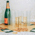 Drinkware including Venetian Champagne Flutes - Set of 6 by Design Ideas on a table.