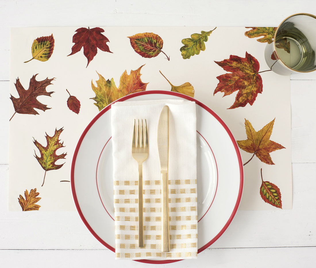 The Fall Foliage Placemat under a place setting, from above.