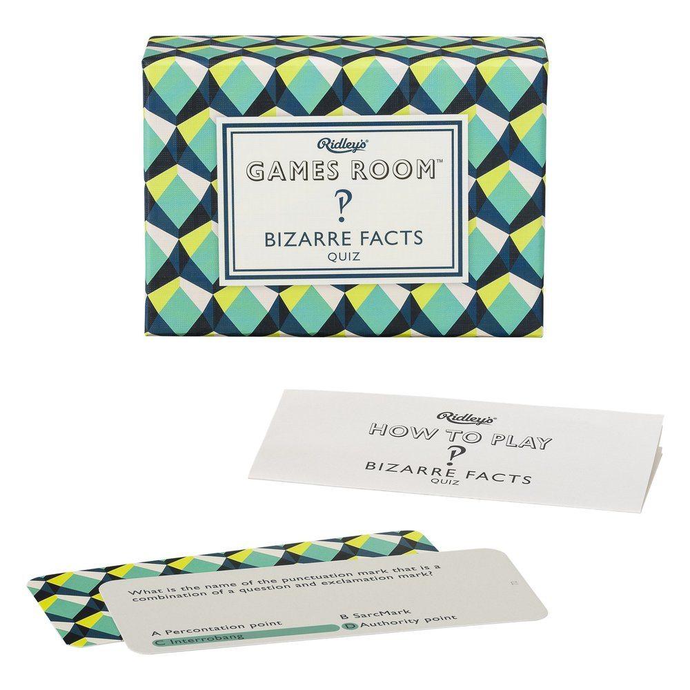 A Chronicle Books Bizarre Facts Quiz gamebook with a card and a piece of paper, perfect for social gatherings.