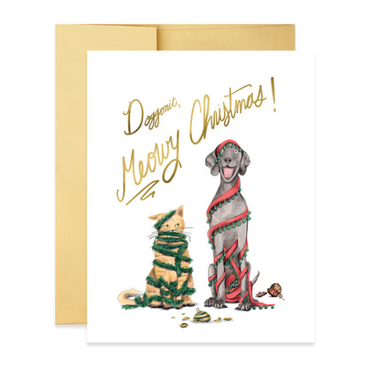 Front of card with a cat and a dog wrapped in holiday decor with the phrase &quot;Doggonit, Meowy Christmas&quot; on it