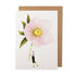 A Pink Hellebore Greeting Card with a woman holding a pink flower, printed on environmentally sustainable paper by Hester & Cook.