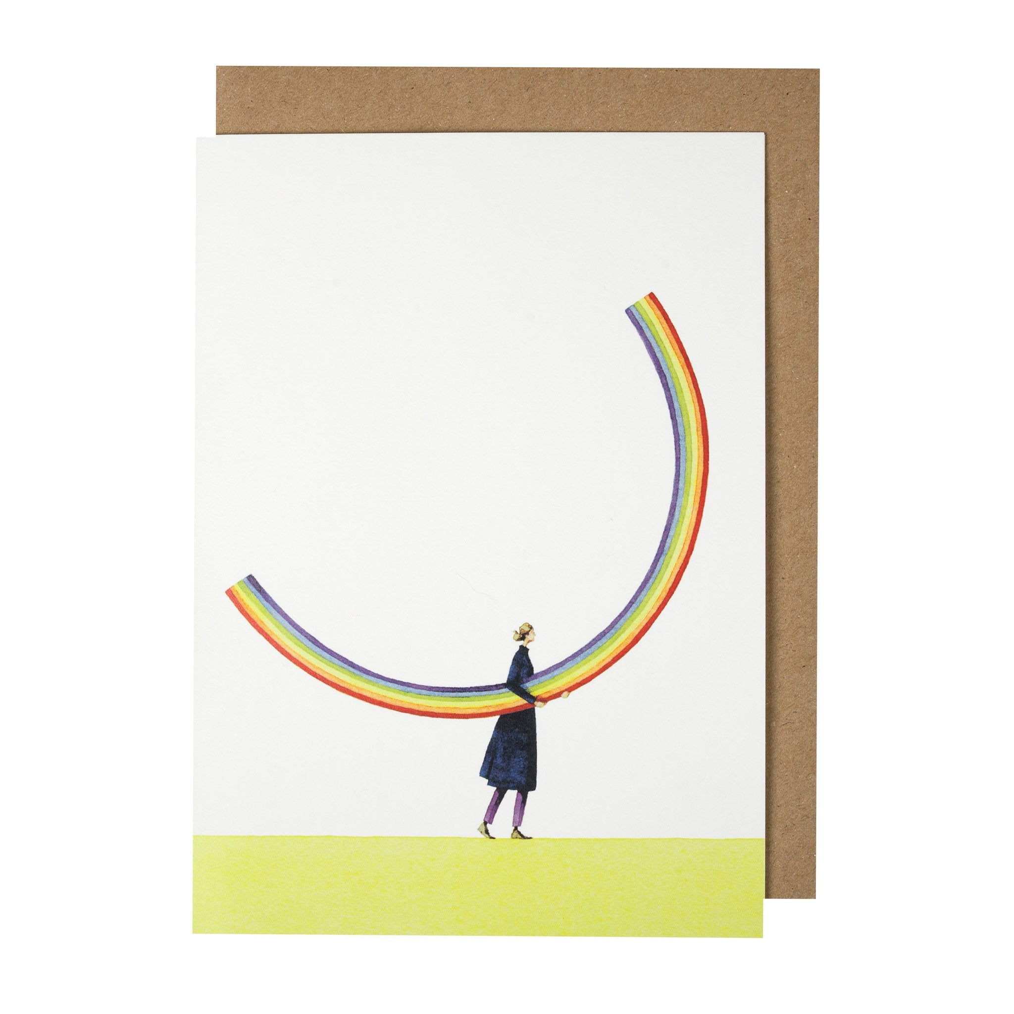 A Rainbow Girl Greeting Card by Hester &amp; Cook, featuring artwork of a woman standing in front of a rainbow, designed to be environmentally sustainable.