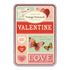 A decorative tin case containing paper valentine cards.