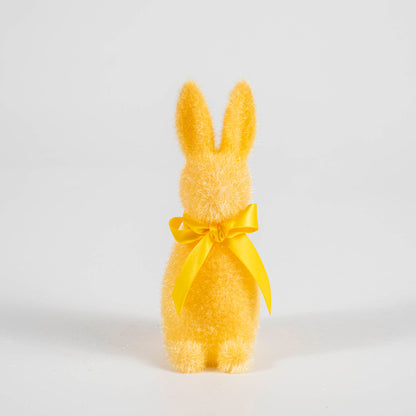 A Small Flocked Pastel Button Nose Bunny with a yellow bow on a white background by Glitterville.