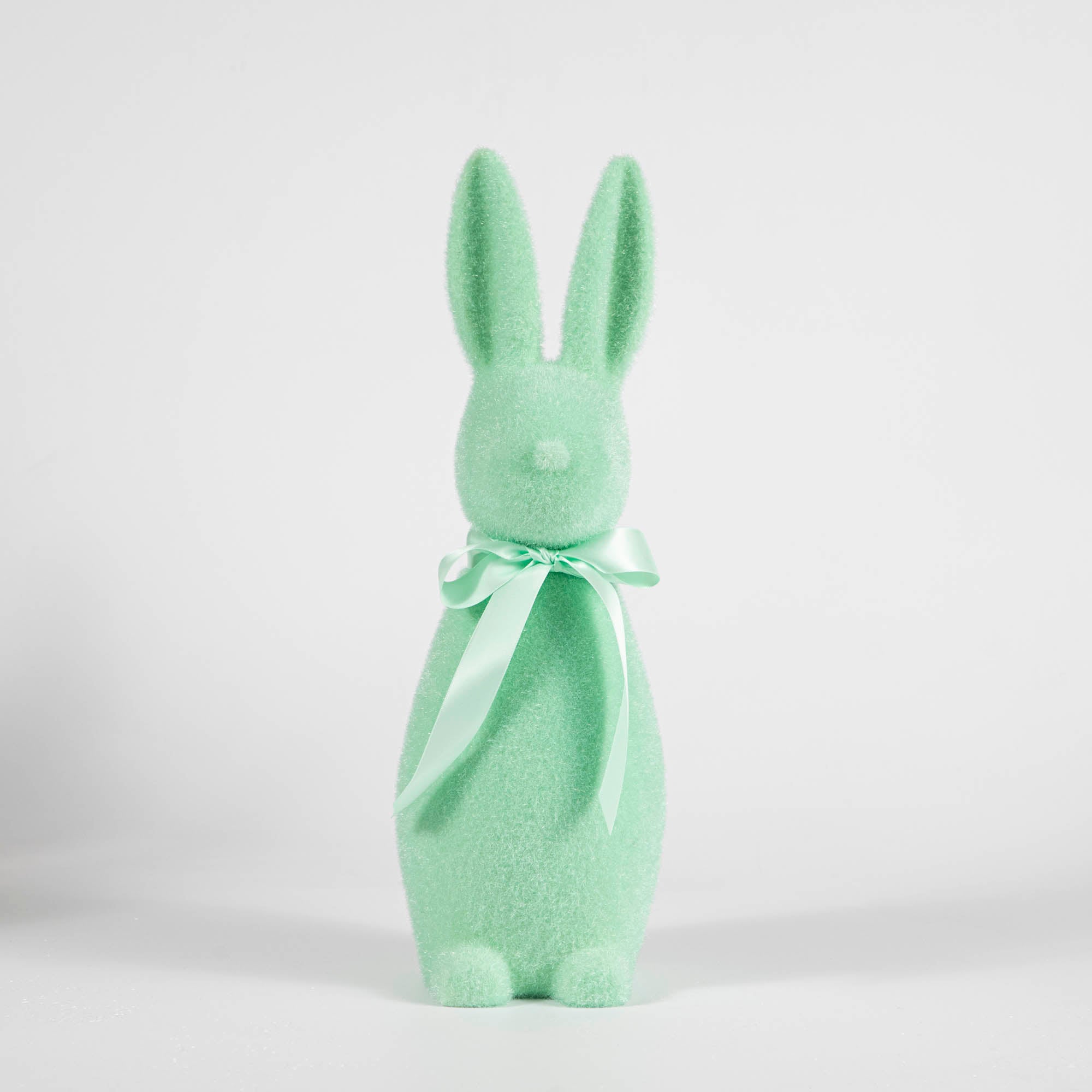 A Medium Flocked Pastel Button Nose Bunny by Glitterville, perfect for Easter and spring decorations, stands out on a white background.