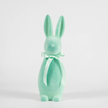 A Medium Flocked Pastel Button Nose Bunny with a bow on a white background, perfect for spring decorations or Easter by Glitterville.