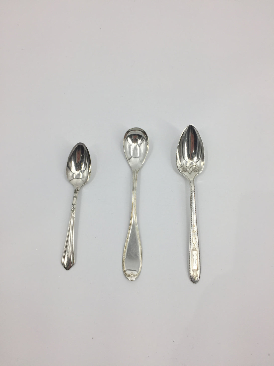 Three Demitasse Spoon open stock by Hester &amp; Cook on a white surface.
