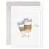 Illustrated greeting card featuring two anthropomorphized coffee cups hugging with the phrase "you&