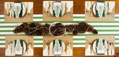 An entertaining table setting with a Dark Green Classic Stripe Runner adorned with pine cones by Hester &amp; Cook.