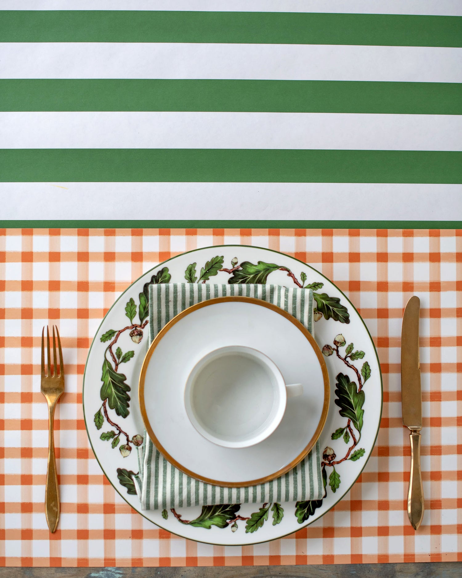 A vibrant Hester &amp; Cook Dark Green Classic Stripe Runner place setting, perfect for entertaining. Complete with a knife and fork, this set is the ideal choice for any host or hostess looking to elevate their table with a