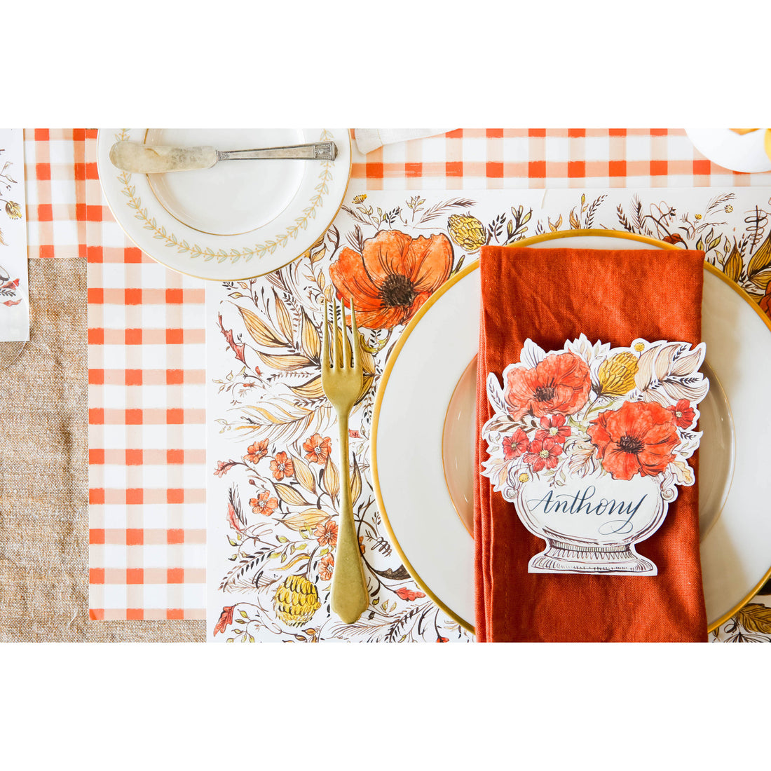 The Orange Painted Check Placemat under a fall-themed place setting, from above. 