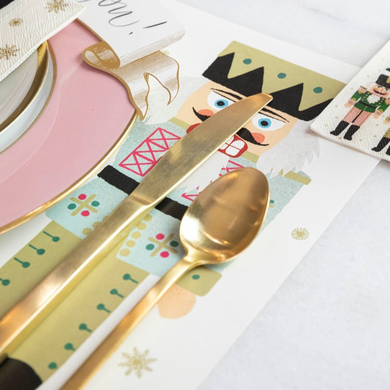 Close-up of the Nutcrackers Placemat under a place setting, showing the rightmost nutcracker in detail.