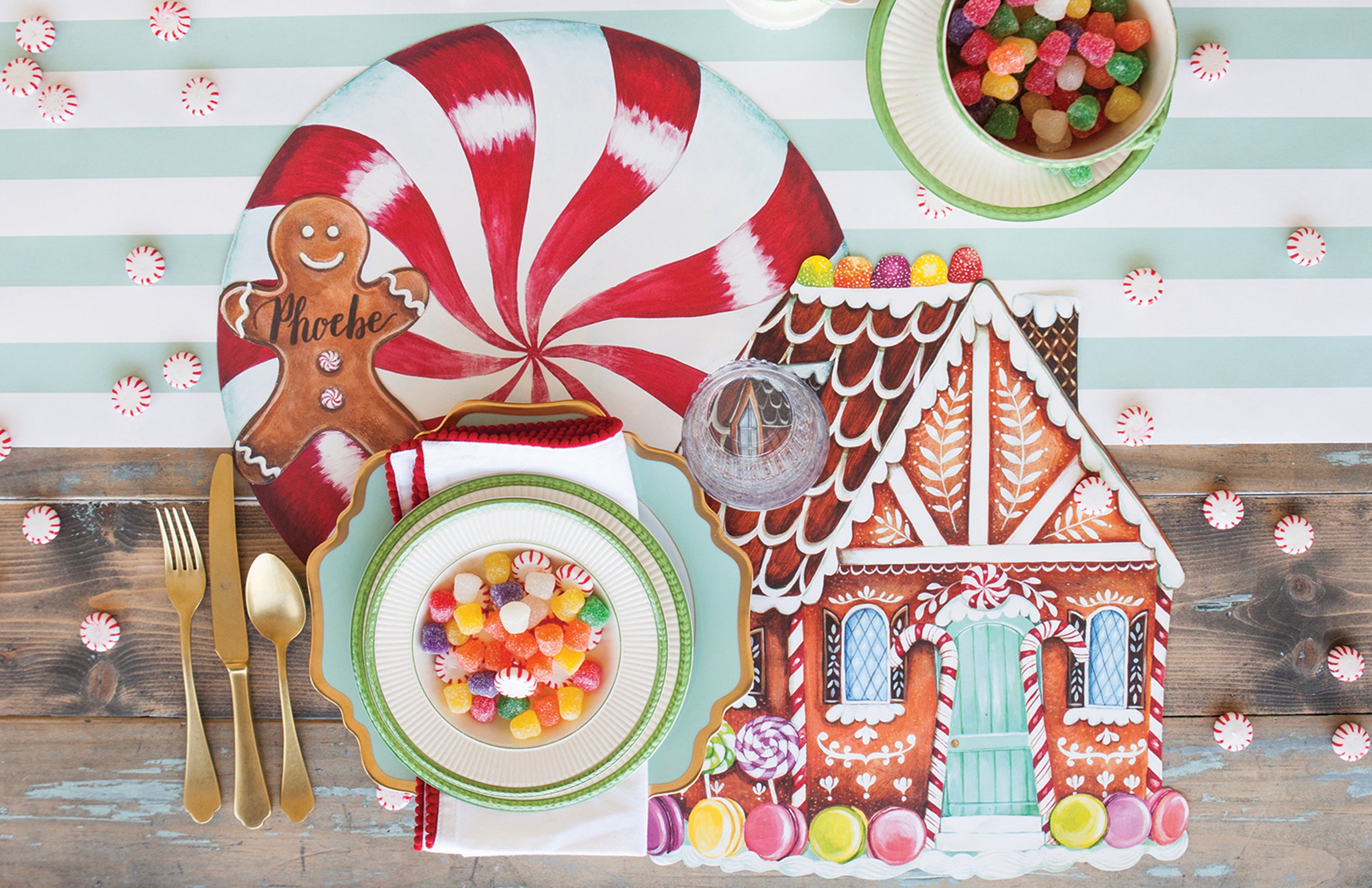 The Die-cut Peppermint Placemat under a festive Christmas candy-themed place setting, from above.
