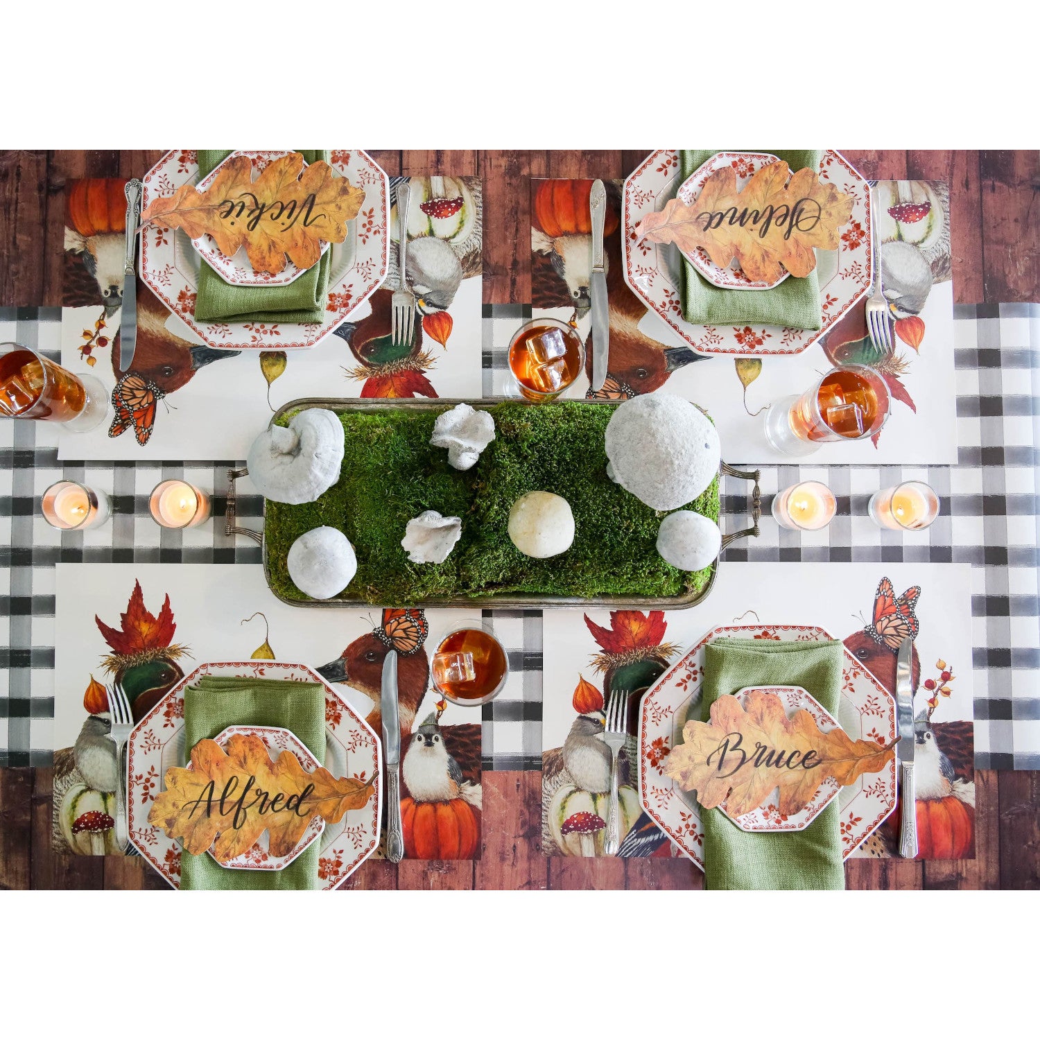 The We Gather Together Placemat under an elegant fall-themed table setting for four, from above.
