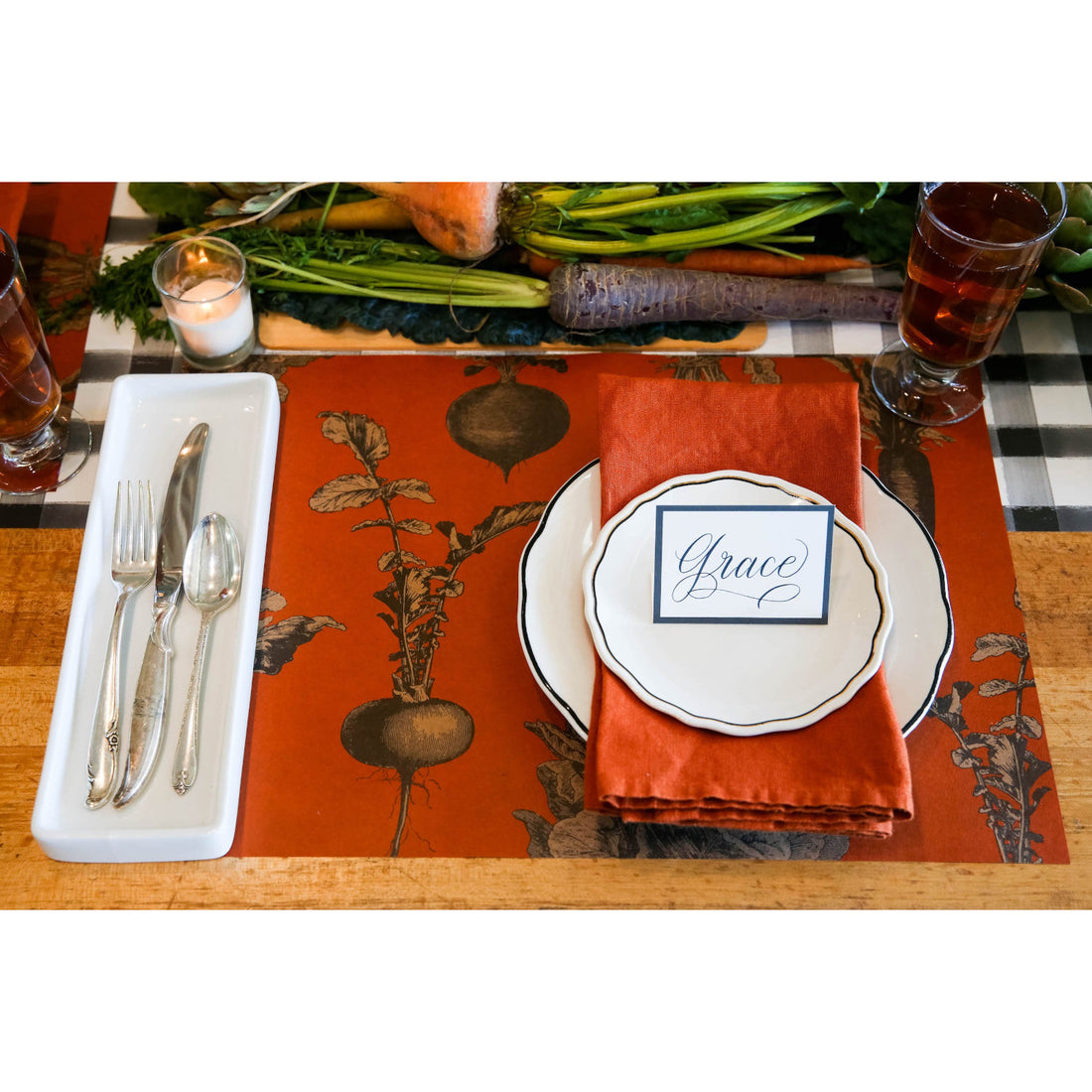 The Harvest Vegetable (Persimmon) Placemat under a rustic place setting.