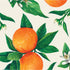 A square cocktail napkin featuring vibrant illustrated oranges with green leaves and white blossoms on a white background.