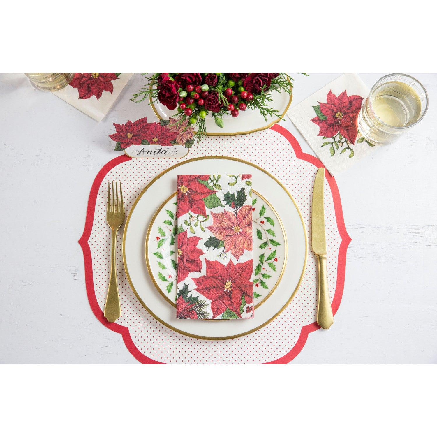 A table setting with Hester &amp; Cook Poinsettia Napkins and a fork.