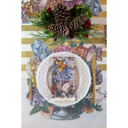 A German table setting with Hester &amp; Cook Dutch Floral Napkins, adorned with flowers and pine cones.