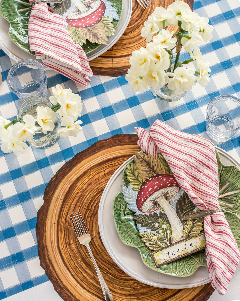 A tablescape with a Hester &amp; Cook Die-cut Wood Slice Placemat.