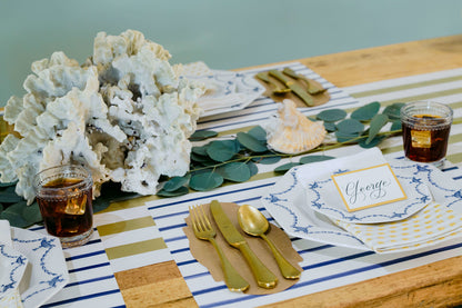 The Navy Stripe Placemat under an elegant table setting.