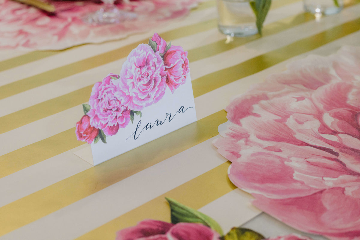 Close-up of a Peony Place Card labeled &quot;Laura&quot; standing in an elegant floral table setting.