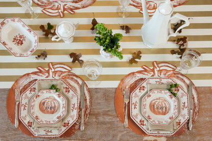 Top-down view of an elegant fall-themed tablescape featuring Pumpkin Place Cards laying flat on each plate.