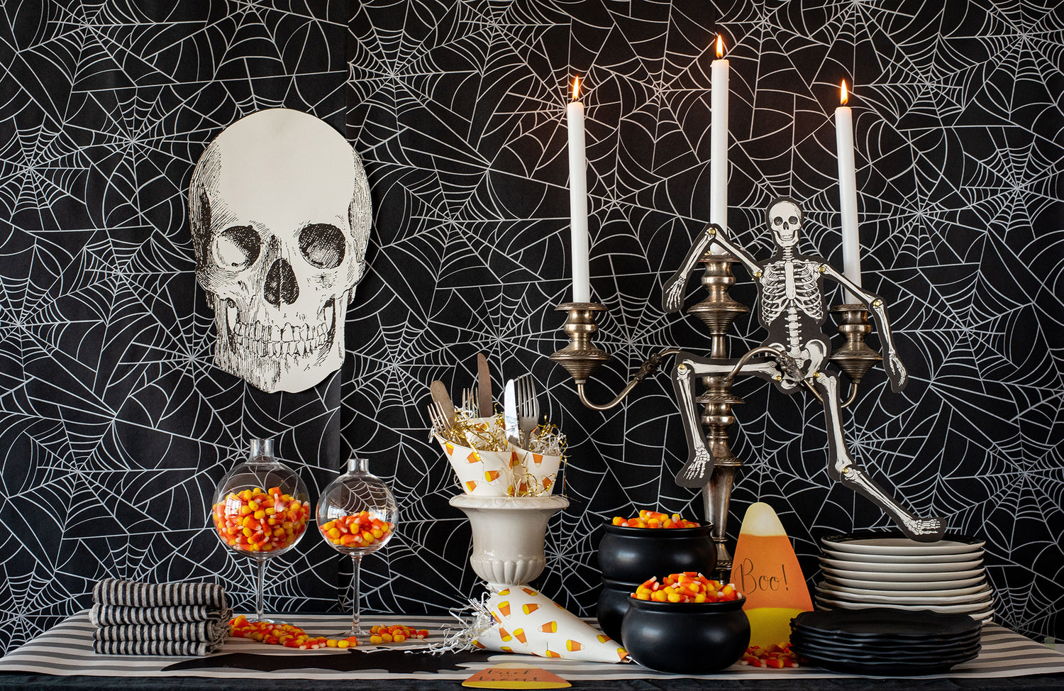The Die-cut Skull Placemat used as decoration for a Halloween treat table.