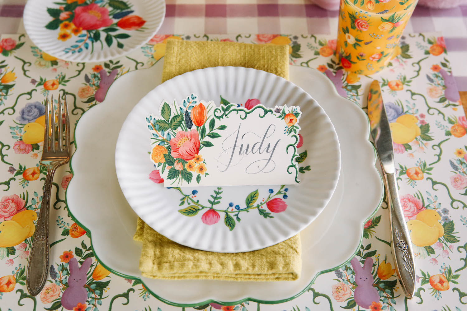 An elegant tablescape with plates, cups, and napkins adorned with PEEPS® Garden Toile Placemats by Hester &amp; Cook.