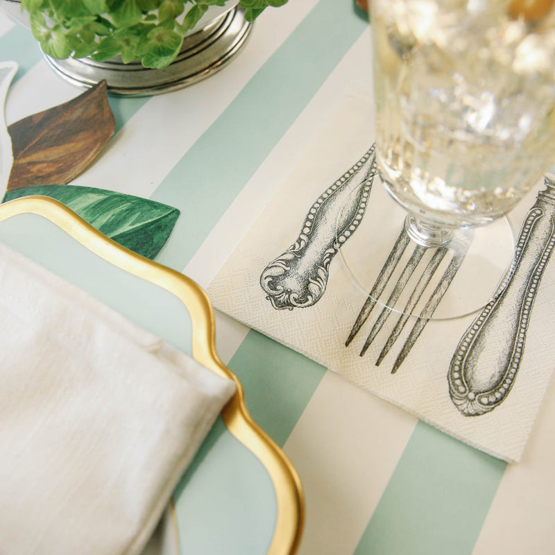 A beautifully arranged table setting with a Seafoam Classic Stripe Runner by Hester &amp; Cook, perfect for entertaining guests.