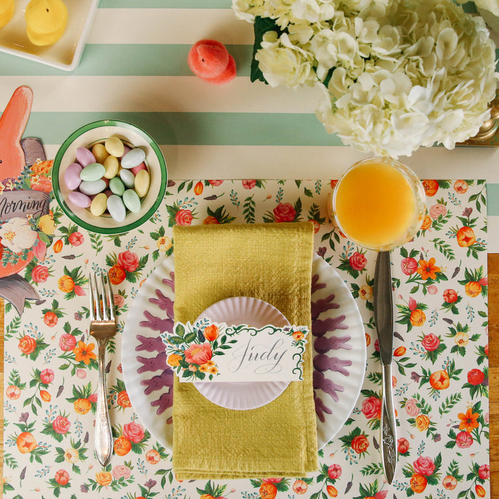 The Sweet Garden Placemat under an Easter-themed place setting, from above.