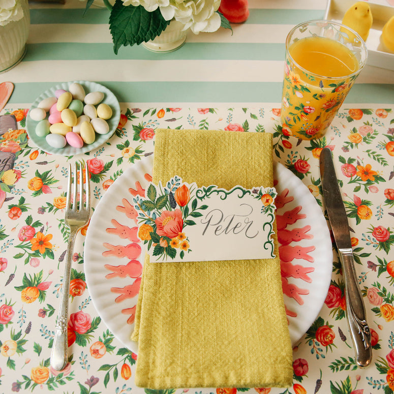Close-up of the Sweet Garden Placemat under an Easter-themed place setting.