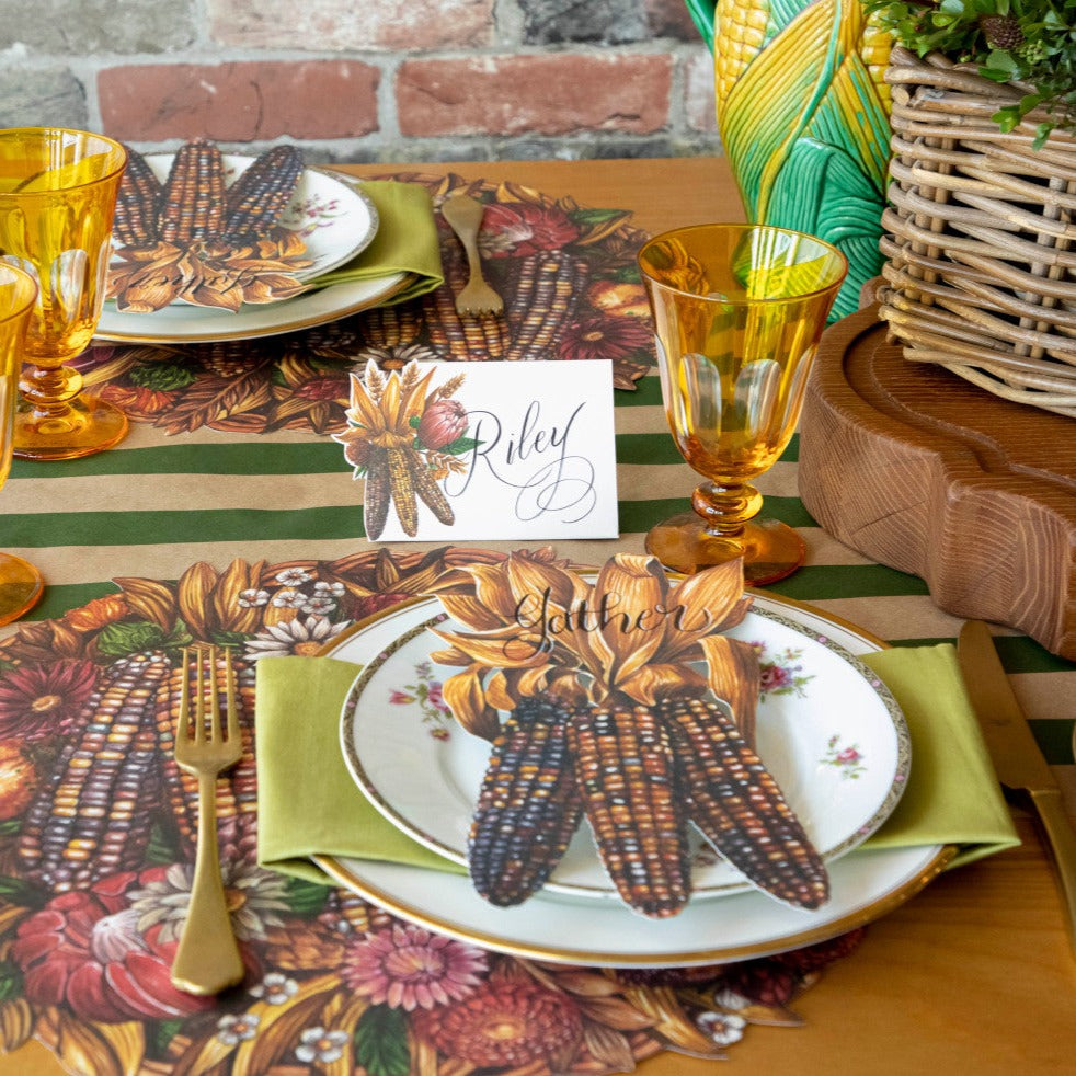 An elegant Thanksgiving tablescape featuring Gathering Place Cards standing behind each plate.