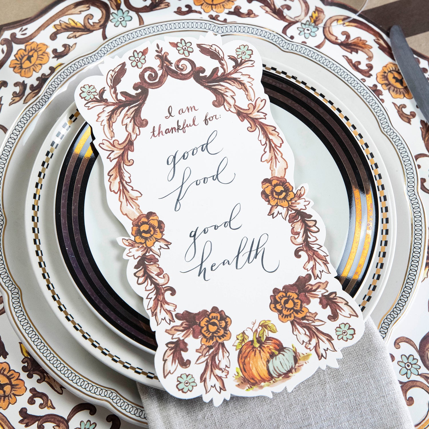 A Hester &amp; Cook &quot;I Am Thankful For&quot; artwork featuring a card plate, serving as a unique and stylish table accent.