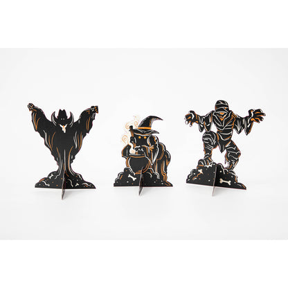 Three Monster Mash Table Ornaments, depicting spooky creatures, on a white background by Hester &amp; Cook.