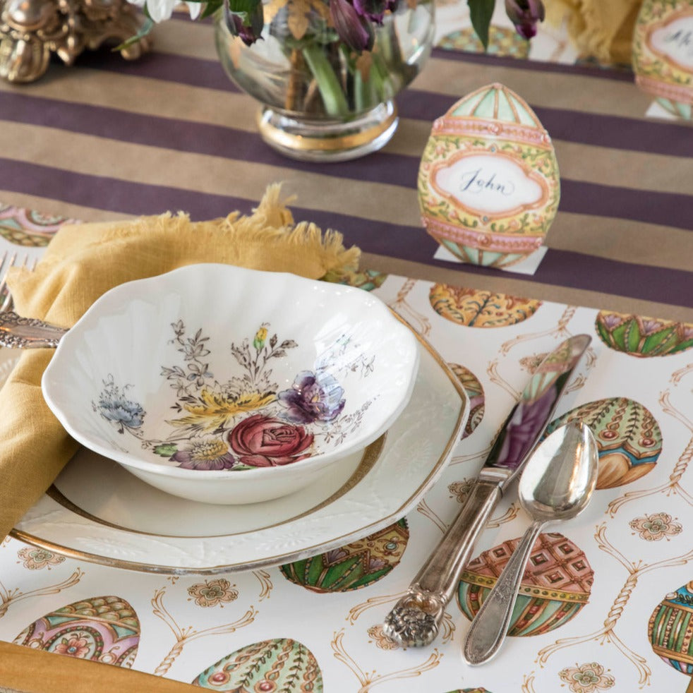 The Exquisite Egg Hunt Placemat under an elegant spring place setting.