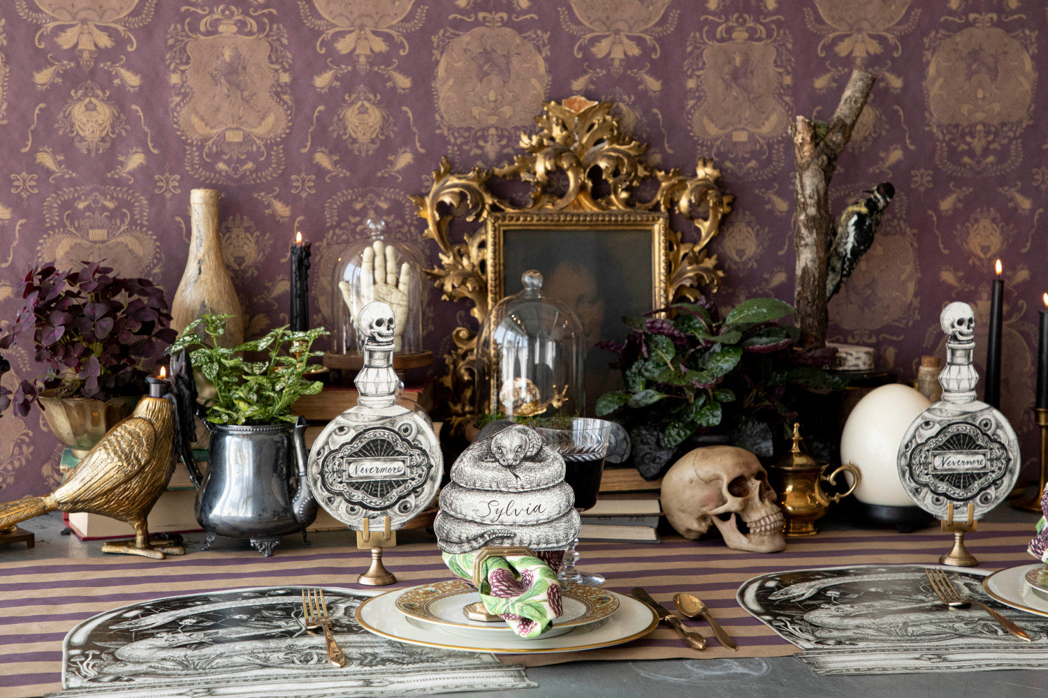 A Halloween-themed table set up with a spooky Hester &amp; Cook Poison Bottle Table Accent.