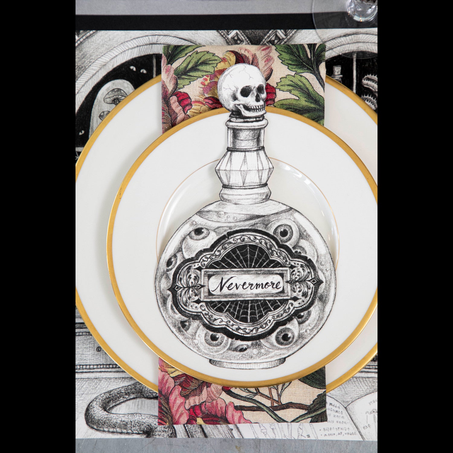 A Halloween Poison Bottle Table Accent featuring a skull and poison bottle on a plate by Hester &amp; Cook.