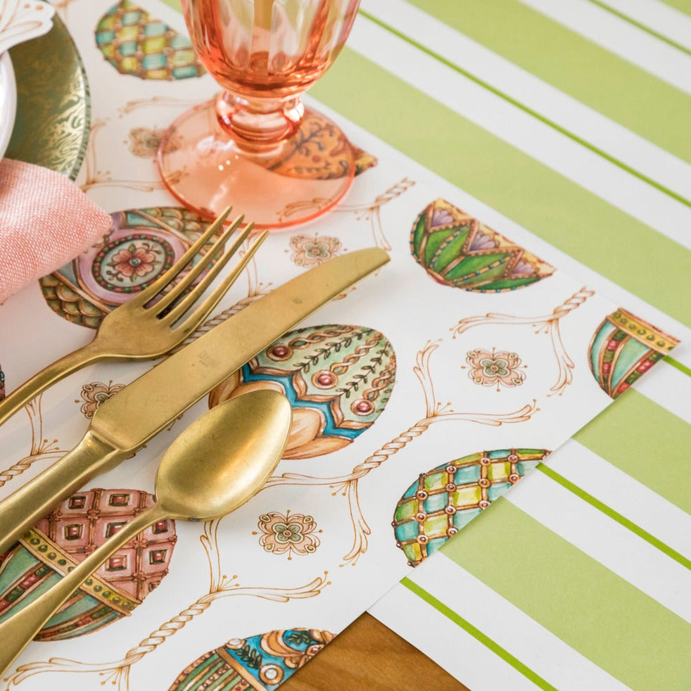 Close-up of the Exquisite Egg Hunt Placemat under an elegant spring place setting.