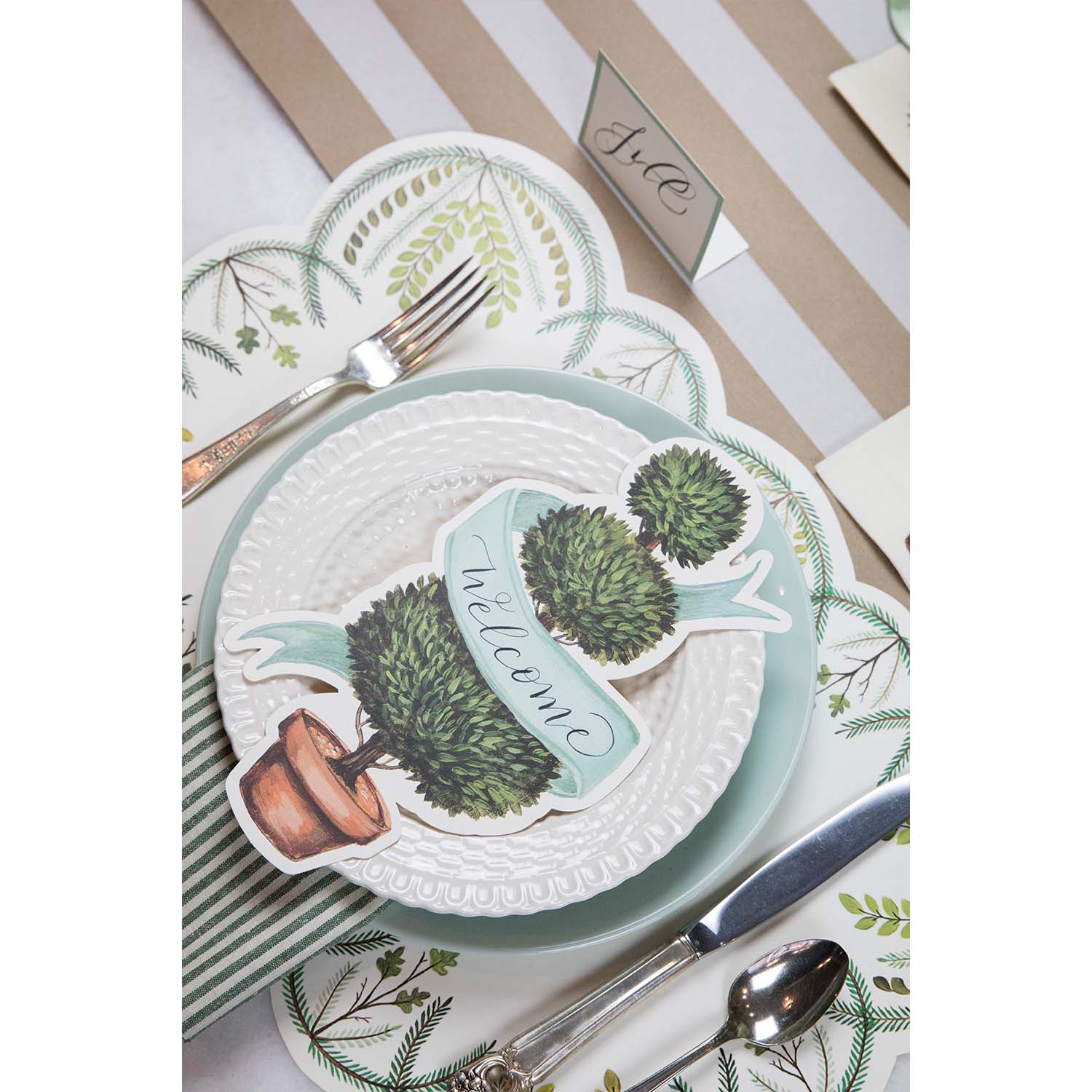 A table setting with a Hester &amp; Cook Topiary Table Accent on it.