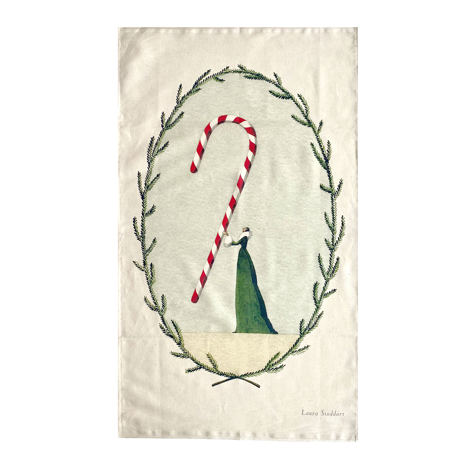 A tea towel featuring an illustration of a woman in a long green dress holding a gigantic candy cane within a frame of winter foliage.