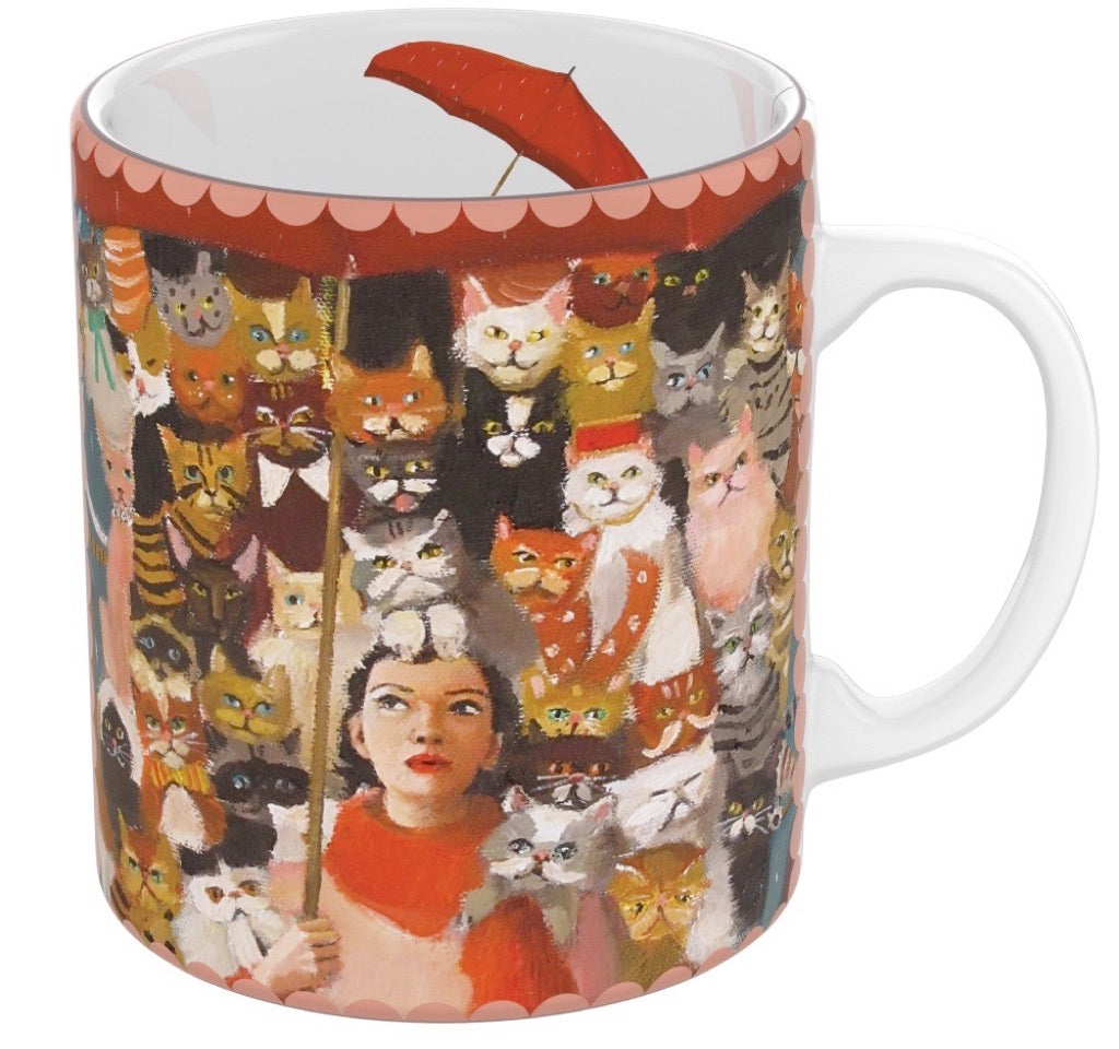 A Cat Countess Mug with an illustration of a woman surrounded by various cats, designed by Janet Hill, from New York Puzzle Company.