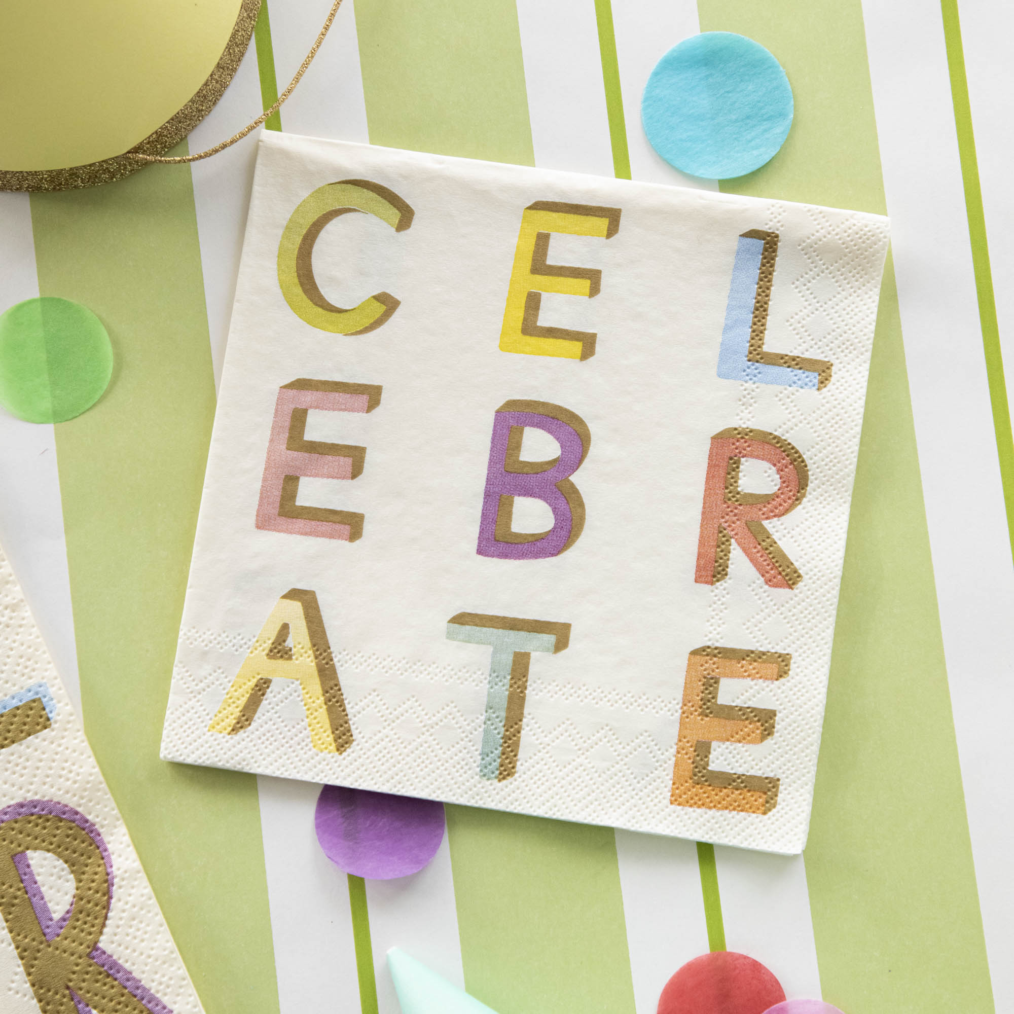 A colorful Celebrate Napkin with the word &