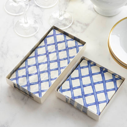 A set of Blue Lattice Napkins by Hester &amp; Cook on a marble table.