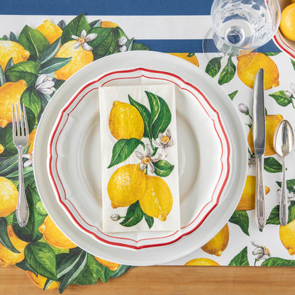 A vibrant table setting with Hester &amp; Cook lemon napkins on it, perfect for any occasion.