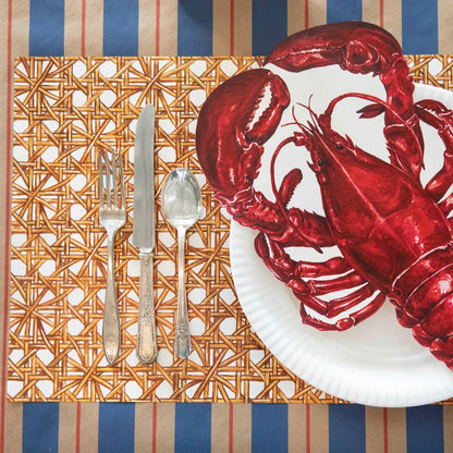 A classic Rattan Weave Placemat with a lobster on it, featuring a rattan weave by Hester &amp; Cook.