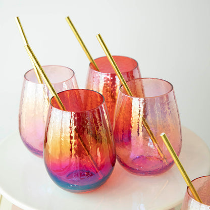 A set of Zodax Luster Stemless Glassware with gold straws, perfect for home use.