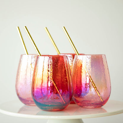 Four colorful Luster Stemless Glassware with gold straws, perfect for drinks at home, displayed on a white plate. (Brand Name: Zodax)